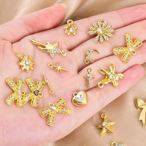 Macro view of gold-plated alloy pendants with zircons for DIY jewelry making