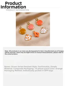 Detail of marine alloy pendants with colorful enamel on premium champagne satin background