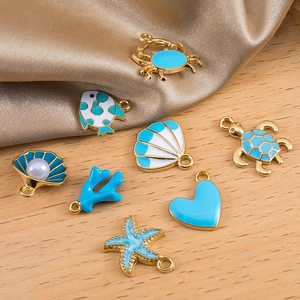 Blue enamel ocean charms set with turtle and starfish on golden alloy for DIY jewelry