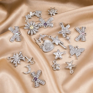 Silver alloy DIY jewelry pendant set with sparkling zircons on elegant champagne satin