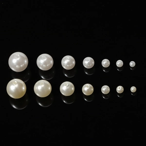 DIY ABS imitation pearls in white and cream white colors with holes across various sizes