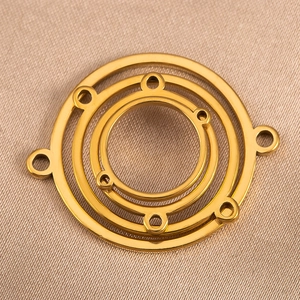Detailed view of triple-layered golden nested round ring connectors for DIY jewelry making