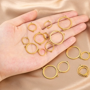 Macro shot of gold-plated stainless steel circular connectors for DIY jewelry accessories