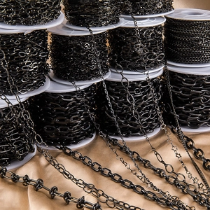 Detailed view of black stainless steel heart and star shaped DIY jewelry link chains