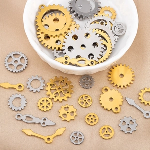 Macro shot of assorted gold and silver steampunk metal gears and clock hands for DIY jewelry
