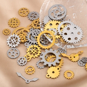 Detailed macro view of mixed gold and silver steampunk gears on champagne silk fabric