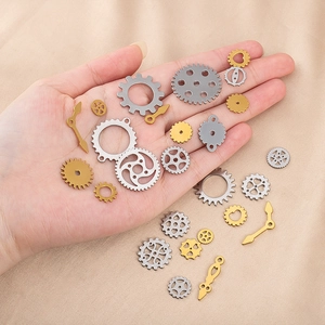 Detailed view of mixed gold and silver mechanical gears and clock pointers on satin