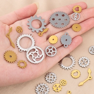 Macro shot of assorted steampunk gears and clock hands for DIY jewelry making
