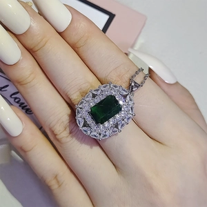 Classic silver-tone emerald green cluster pendant necklace with white zircon accents