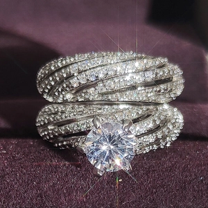 Luxury silver dual-layer zircon ring set with a large round center stone in 4-claw setting