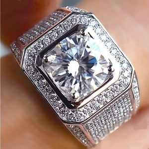 Close-up of a square-cut diamond ring featuring a double halo and micro-pave setting