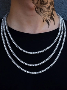 Close-up of triple-layered silver tennis necklace with sparkling cubic zirconia on model