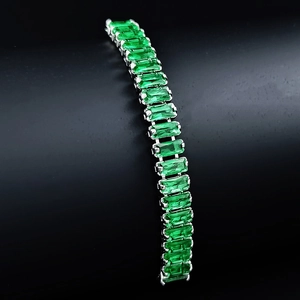 Macro shot of emerald cut green crystals on adjustable silver plated bracelet chain