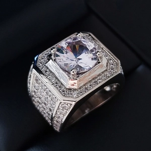 Macro detail of luxury men's ring with central zircon and pave-set octagon frame