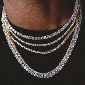 Detail of layered gold tennis necklaces with shimmering round-cut zircon stones