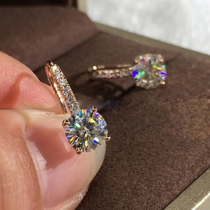 Macro detail of S925 sterling silver hoop earrings with sparkling round cubic zirconia