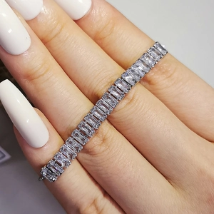 Adjustable silver bracelet featuring rectangular baguette-cut clear zirconia stones