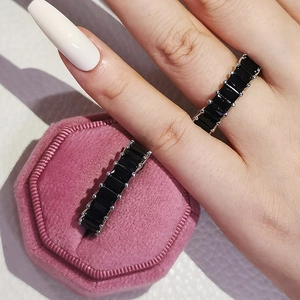 Luxury eternity ring with rectangular black zircon stones in silver-toned setting