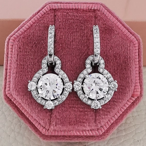 Luxury round halo earrings with white zircon on pink velvet hexagonal jewelry box