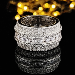 Luxury silver square zircon ring with pave diamonds on a reflective black background