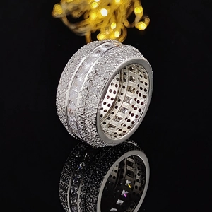 Luxurious silver square zirconia wide band ring with shimmering crystals on black mirror
