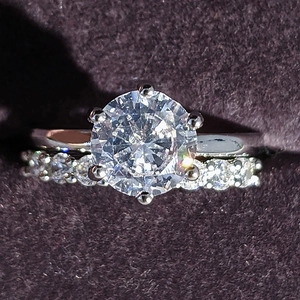 Sparkling silver engagement wedding ring set with round solitaire and pave bands