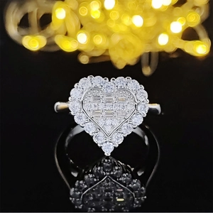 Elegant heart-shaped silver jewelry set with pave-set crystals on black reflection