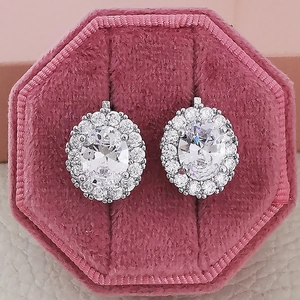 Sparkling AAA zircon halo stud earrings with oval main stone in a velvet gift box