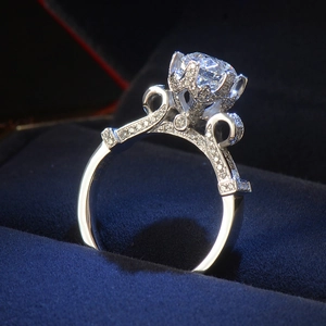Macro side view of vintage luxury engagement ring with round crown-set diamond and pavé band