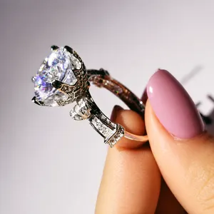 Close-up of vintage engagement ring with crown setting and sparkling side stones