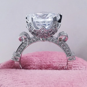 Vintage luxury engagement ring with large round diamond in pink velvet jewelry box