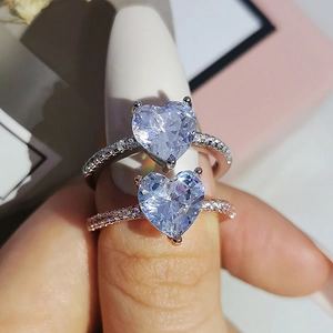 Elegant heart-shaped zircon engagement rings in silver and rose gold pavé settings