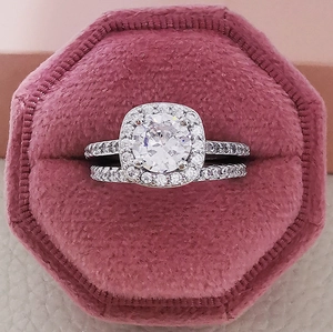 Luxury three-piece ring set with round cubic zirconia in a pink velvet jewelry box