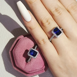 Fashion jewelry set with royal blue emerald-cut sapphire ring and pink velvet box