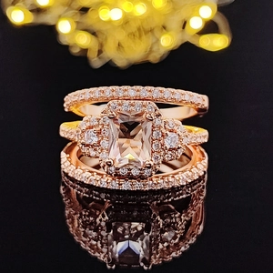 Rose gold engagement ring set with rectangular centerpiece and micro-pave diamond accents