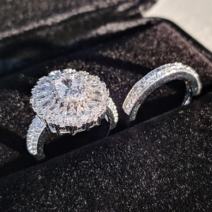 Luxurious oval halo cluster ring set with sparkling zircon in a black jewelry box