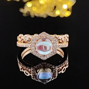 Rose gold moonstone stacking ring set with hexagonal halo and vintage hollow pattern