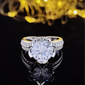 Luxury round cut engagement ring with six-prong petal setting and pavé band on black mirror