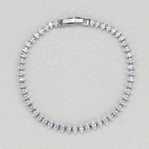 Elegant marquise-cut crystal tennis bracelet with silver plating and secure fold-over clasp