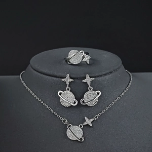 Sparkling zircon Saturn planet jewelry set including necklace, earrings and ring on a bust