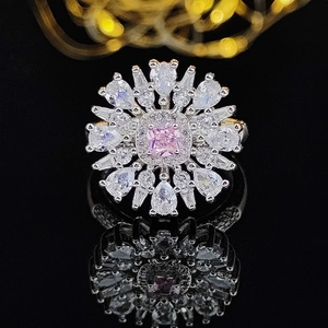 Luxury pink square gemstone flower ring with radiating white zircon petals on black background