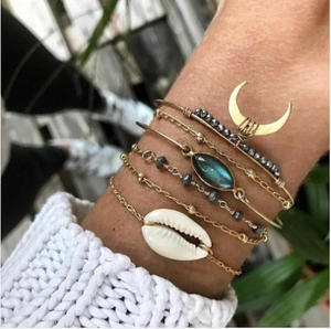 Bohemian multi-layer gold bracelet set with moon charm, blue gemstone and white seashell