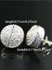 Detail view of round silver studs with pave zircons showing 0.71cm size and reflection