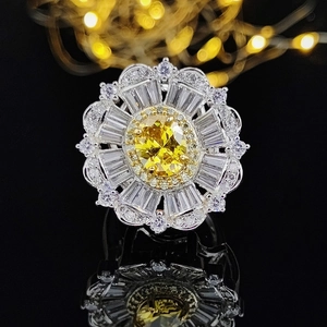 Luxury flower ring featuring an oval yellow diamond center surrounded by small crystals
