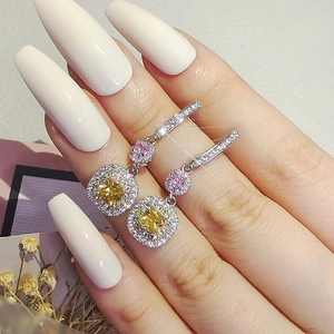 Exquisite long drop earrings featuring yellow and pink gemstones with pavé-set crystals