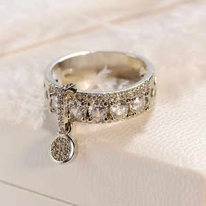 Sparkling S925 sterling silver ring with cubic zirconia and a round dangling charm