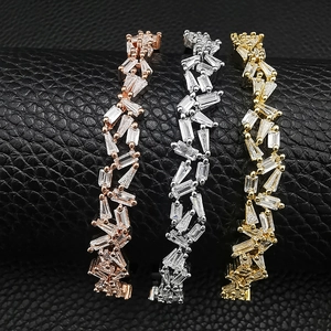 Detailed view of three irregular adjustable bracelets with baguette-cut cubic zirconia