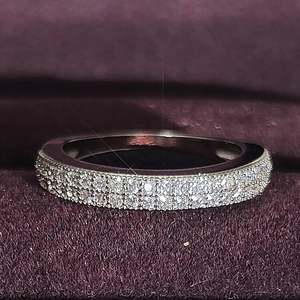 Elegant multi-layer micro-pave ring with sparkling white stones in silver-toned metal
