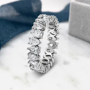 Eternity band featuring pear-cut teardrop stones in a polished silver finish