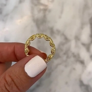 Elegant gold eternity ring featuring a full circle of oval cut yellow gemstones for women